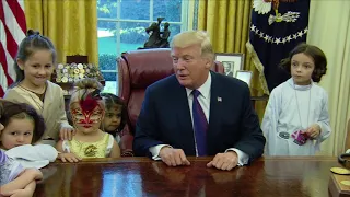 Children of White House press corps visit Trump in the Oval Office