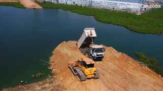 Dump Truck And Bulldozer Doing Pushing Land Connecting New Road - Bulldozer Working Connect New Road
