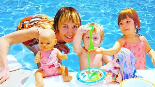 Kids Play Dolls & Feeding Baby Born Dolls at the swimming pool - Funny babies & Family fun video