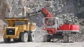 O&K RH30-E front shovel loading O&K K50