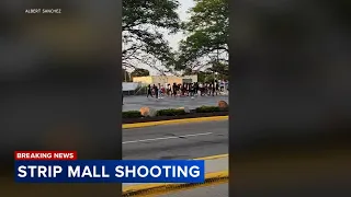 Teen injured in strip mall shooting during large gathering, police say