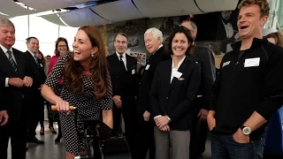 Watch: Kate Middleton shows off tan and growing baby bump