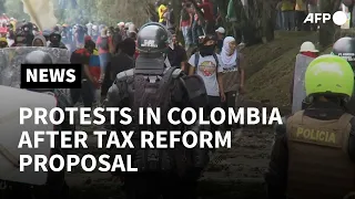 Colombians protest tax reform proposal, clash with police amid pandemic | AFP