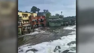 High surf floods waterfront residences in Capitola