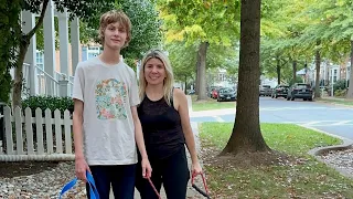 Gabe an autistic and nonverbal teen practices walking his dog with his moms!