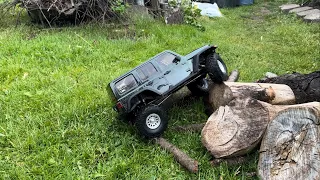 Scx10.3 kit first run and scx10.2 deadbolt on log pile