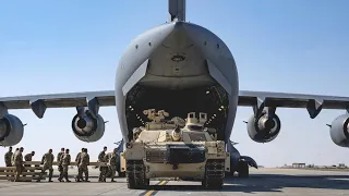 Expeditionary Airlift Squadron flying an M1A2 SEPV2 Abrams Tank over Ali Al Salem Air Base