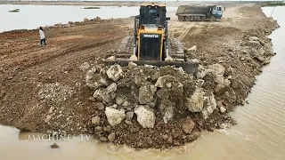 Dynamic Operator Bulldozer Dump Truck Pushing Unloading Rock Dirt Build New Road Over Big Lake