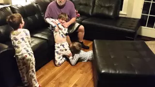 Grandpa Kellogg and grandkids wrestling