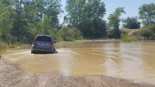 GX 470 playing in the lake