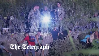 Title 42: Guards smile as they watch desperate migrants struggle to cross