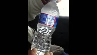 Watch the water freezing in bottle when bottle is opened!