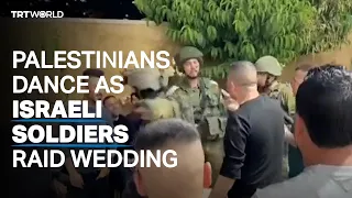 Palestinians dance as Israeli soldiers raid wedding