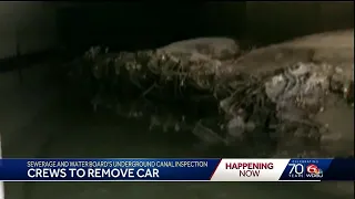 Crews work to remove cars from underground Mid-City canal