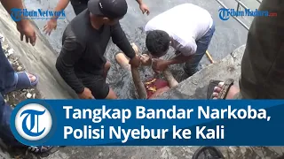 Licin Seperti Belut, Bandar Narkoba Sembunyi di Dalam Kali Memaksa Polisi Ikut Nyebur.