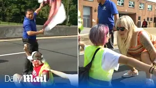 'I've got kids to feed!': Furious commuters confront climate activists in Washing DC