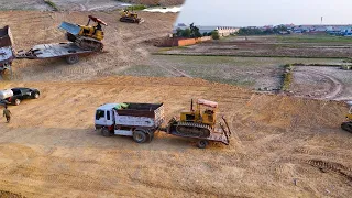 he way the workers work is very neat, the bulldozer levels the ground with a Cat KOMATSU D31P