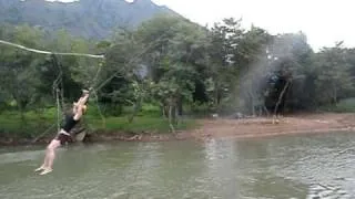 Dasha on the rope swing at a Tubing Bar in Vang Vieng, Laos