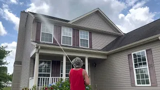 Washing a 2 Story House Without a Ladder : X-jet system in action .