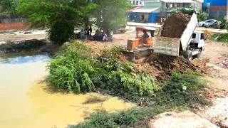 This is video New project Landfilling using Bulldozer komatsu D31p Working push soil / Dump truck 5T