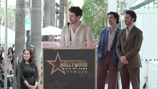 Jonas Brothers give shout-out to wives, parents while getting their Walk of Fame star