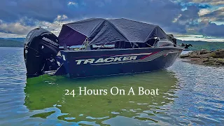 Camping On The Boat Under A Tarp On A Mountain Lake