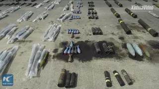 Syrian army shows confiscated weapons from Daraa province