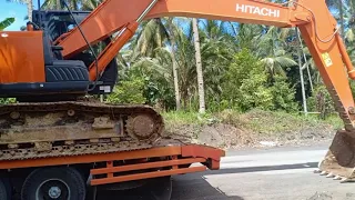 cara menurunkan excavator dari tronton