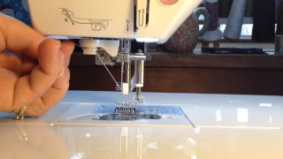 Using the automatic needle threader on the Brother NQ900 sewing machine