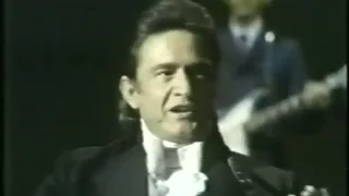 Johnny Cash sings "Wrinkled, Crinkled, Wadded Dollar Bill"