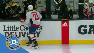 Garnet Hathaway's hit upends Charlie McAvoy into Brian Boucher's box.