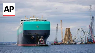 First ships pass through temporary channel past Baltimore bridge wreckage