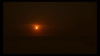 Time lapse video of full moon rising above the horizon of the Atlantic Ocean