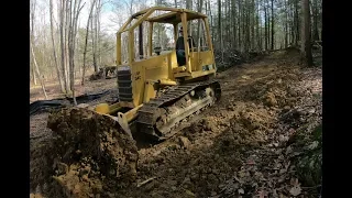 Pushing in a driveway with a bulldozer