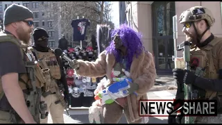 Performance artist "Crackhead Barney" trolls pro-gun activists open carrying rifles in Virginia