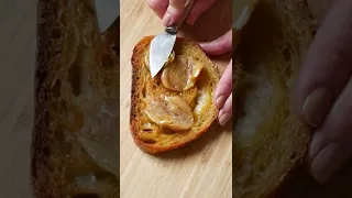 Garlic confit, hot honey, prosciutto and burrata on toast