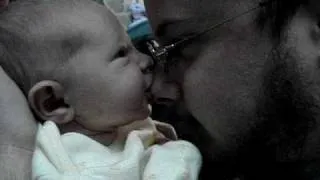 Baby Alice nursing on daddy's nose