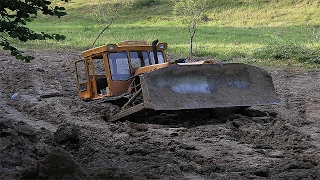 Tractor stuck in mud compilation. Complete absence of roads. Impassable mud