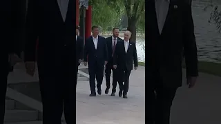 China's Xi and Russia's Putin share a hug in Beijing