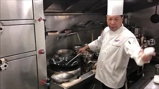 Chef Jian Chit Ming prepares a sweet and sour dish at 2 Michelin star Canton 8 in Shanghai, China