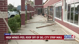 High winds snap power lines and damage businesses