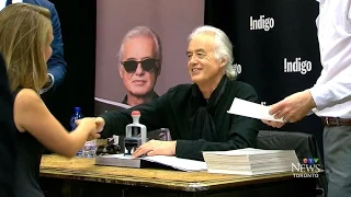 Jimmy Page uses stamp with logo to sign books for fans