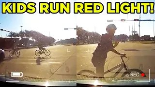 KIDS RUN RED LIGHT AND ALMOST GET HIT.. (IDIOT DRIVERS)