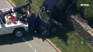 Car crashes over retaining wall in Market Basket parking lot