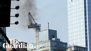 New York: crane collapses onto Manhattan street after catching fire