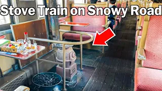 Riding on a winter only small local stove train in the extremely cold snowy country