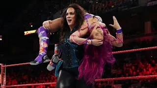 Nia Jax brutalizing Sasha Banks