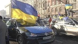 Ukraine's anti-government protesters drive away campaign fatigue with a car rally in Kyiv
