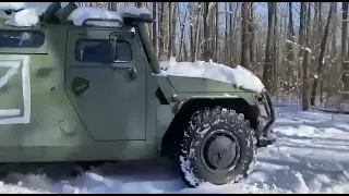 Ukrainian troops drive away in a Russian Tigr-M armoured vehicle near Kharkiv