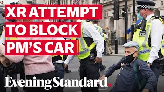 Extinction Rebellion try to block Prime Minister's motorcade from reaching Parliament